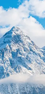 Snowy mountain peak under a blue sky.