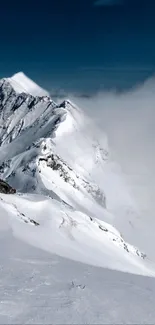 Snowy mountain peaks with a clear blue sky.