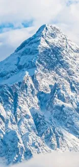 Snowy mountain peaks with blue sky creating a serene and majestic view.