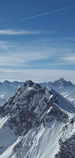 Snowy mountain peaks under a clear blue sky.