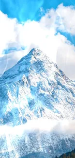 Snow-covered mountain range under a clear blue sky with fluffy clouds.