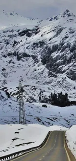 Snowy mountain road with power lines and winter landscape.