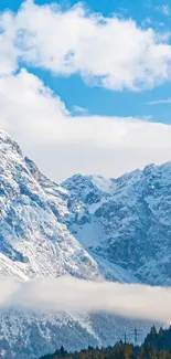 Snowy mountains under blue sky mobile wallpaper.