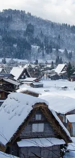 A scenic view of a snowy mountain village with rustic rooftops and forested hills.