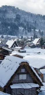 A snowy mountain village with traditional houses under a clear blue sky.