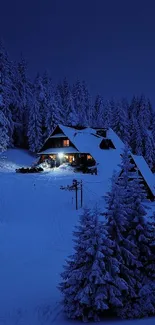 Snowy forest cabin illuminated under a dark blue night sky.