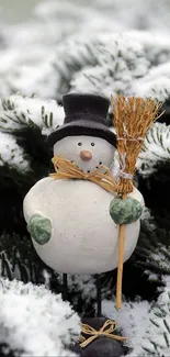 Charming snowman with broom surrounded by snowy branches.