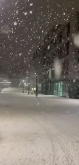 Snowy night street scene with glowing streetlights.