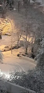 Snow-covered street under streetlights in a winter cityscape.