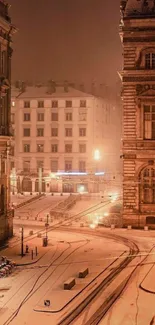 Snow-covered city street with historic buildings under a warm evening glow.