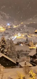 Snowy village with warm lights at night.