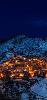 Snowy mountain village at night with glowing lights.