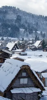 Snowy village with mountain backdrop, perfect for serene winter wallpaper.