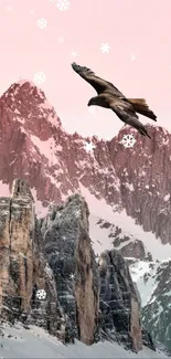 Eagle flying over snow-capped mountains under a pink sky.