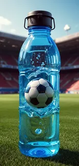 Soccer ball inside a water bottle on a lush green stadium field.