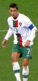 Soccer player on green field in action, wearing white and green uniform.