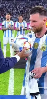 Soccer player receiving a trophy in a stadium during a victory celebration.