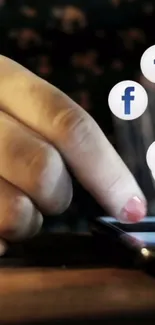 Hand touching smartphone with Facebook icons floating.