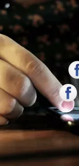 Hand interacting with Facebook icons on a smartphone screen.