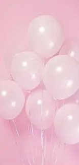 A soft pink wallpaper with floating balloons.