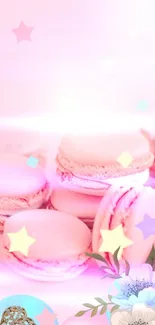 Soft pink macarons decorated with stars and floral elements on a dreamy wallpaper.