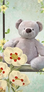 Teddy bear on a swing surrounded by flowers.