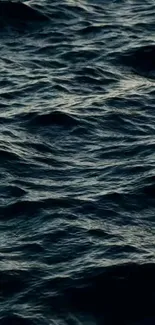 Dark blue ocean waves creating a calming mobile wallpaper.
