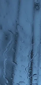 Blue rain-soaked window wallpaper for mobile.