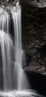 Serene waterfall cascading over rocky cliffs.