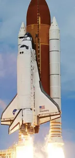 Space shuttle launching into blue sky with rockets igniting beneath.