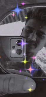 Mirror selfie with colorful star sparkles on a monochrome background.