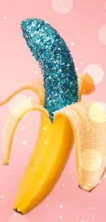 Banana with blue glitter on pink background, artistic phone wallpaper.