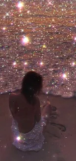 Woman silhouetted on sparkling beach at night under starry sky.