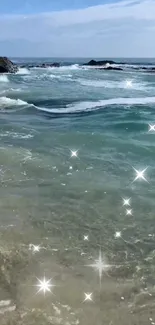 Sparkling ocean waves with beach view on a sunny day.