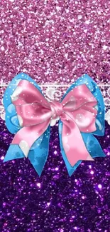 Sparkling pink and purple wallpaper with a blue and pink bow.