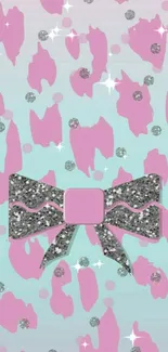 Pink patterned wallpaper with a sparkling bow design.