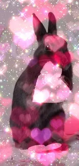 Cute black bunny holding a pink heart amidst sparkles.