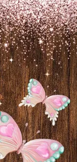 Pink butterflies on glittering wood background.