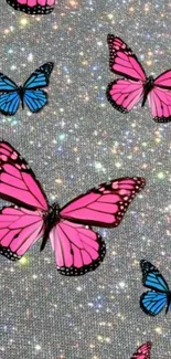 Sparkling pink and blue butterflies wallpaper