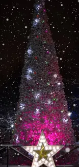 Glowing Christmas tree with vibrant lights at night.