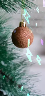 Festive mobile wallpaper with a copper Christmas ornament on a green pine branch.