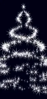 Sparkling white Christmas tree lights on black background.