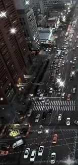 City street at night with sparkling lights and traffic.