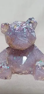 Lavender sparkling bear statue with glittering details.