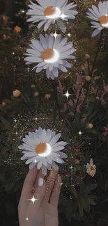 Hand holding sparkling daisies at night in a mystical setting.