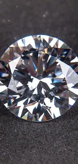 A clear diamond resting on a dark surface, showcasing elegance and brilliance.