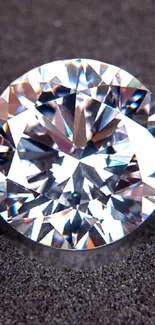 High-resolution image of a sparkling diamond on gray background.