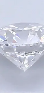 Sparkling diamond gem with light background.