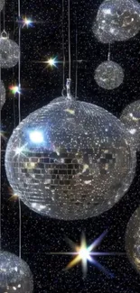 A mobile wallpaper featuring shining disco balls against a starry night background.