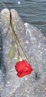 Sparkling dolphin holding a red rose in ocean.